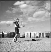 On the beach at Brighton Beach a man exercised with nanchuks in the winter sunshine